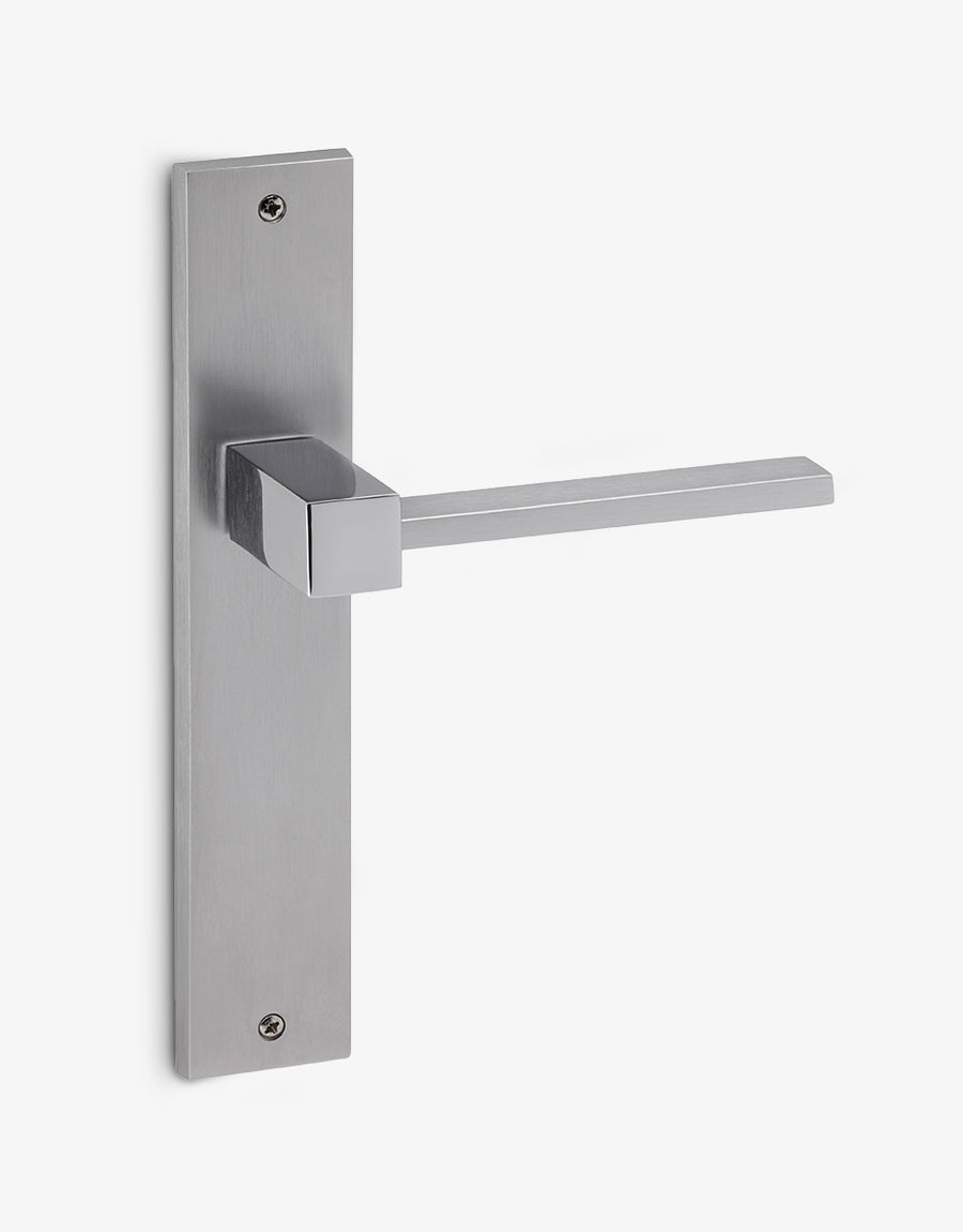 Plano door handle set on a rectangular backplate