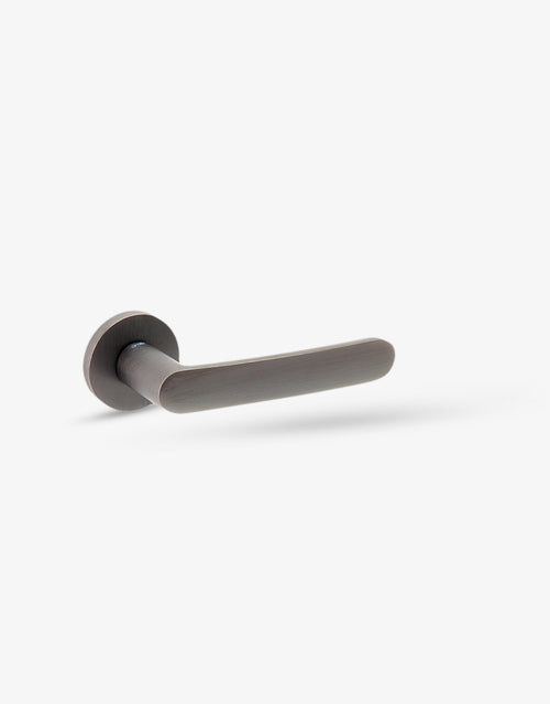 Tendenza door handle set on round rose